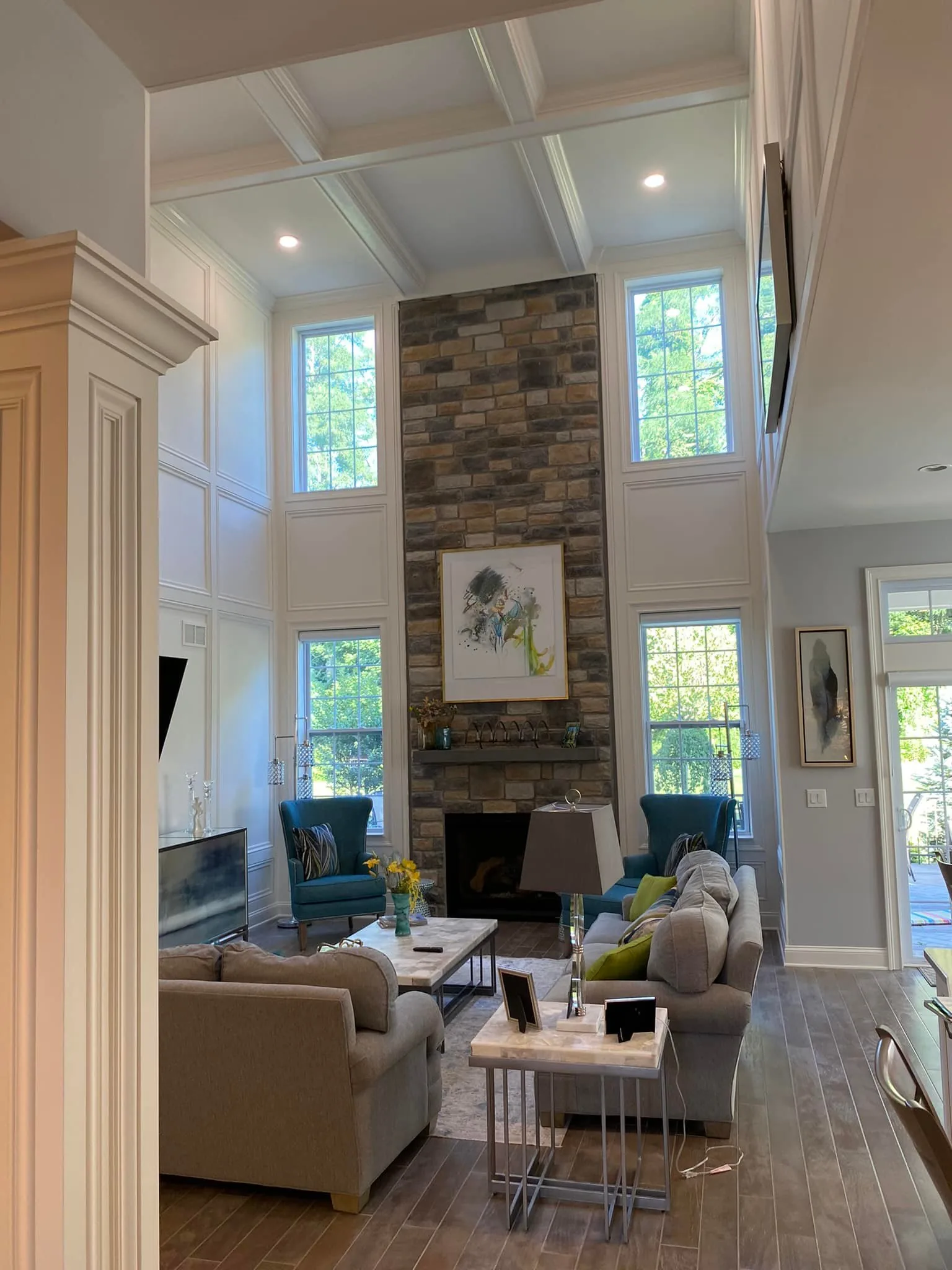 Stone Hearth Under Coffered Ceiling — custom carpentry by Custom Interiors & Remodeling